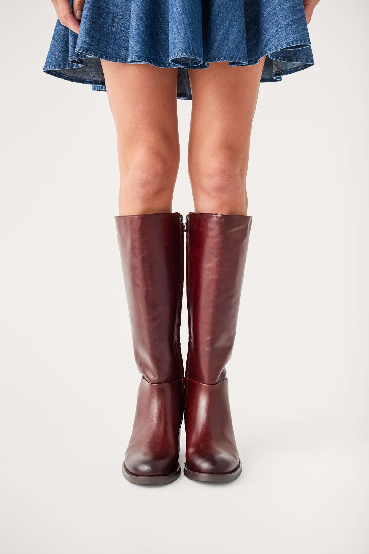Dark brown leather knee-high boots with low stacked heel, pull-on shaft