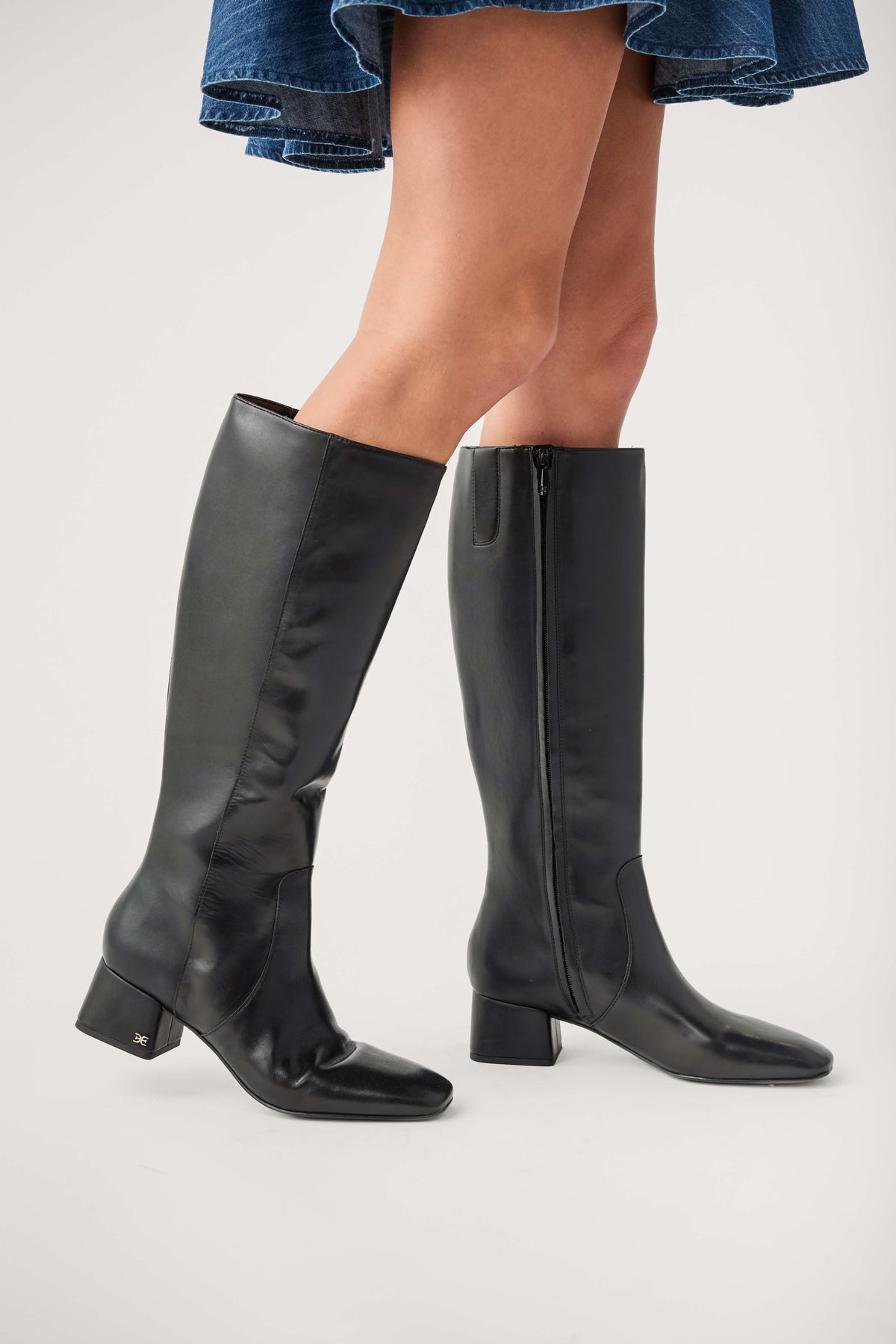 Black knee-high leather boots with side zipper and square toe block heel