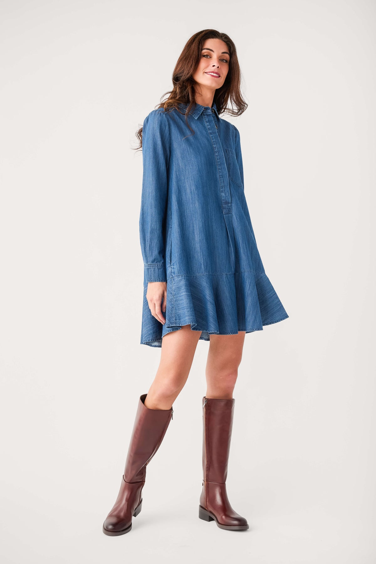 Blue denim shirt dress with button front, collar, and tiered skirt hem