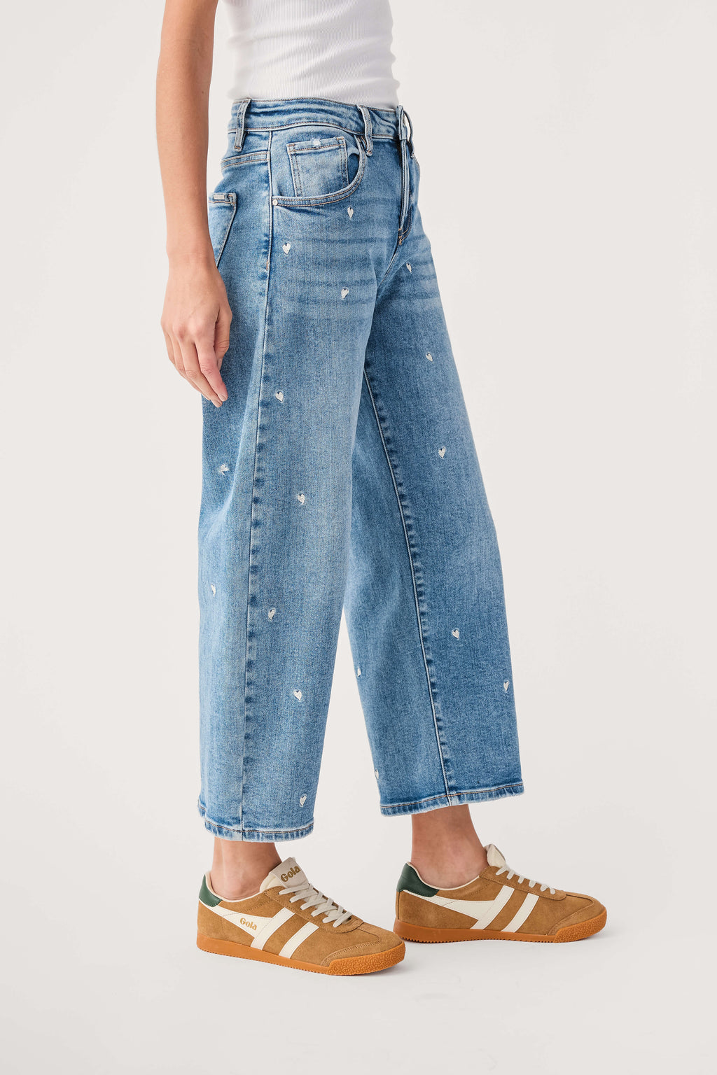 Light blue cropped barrel jeans with embroidered speckled texture and side seam