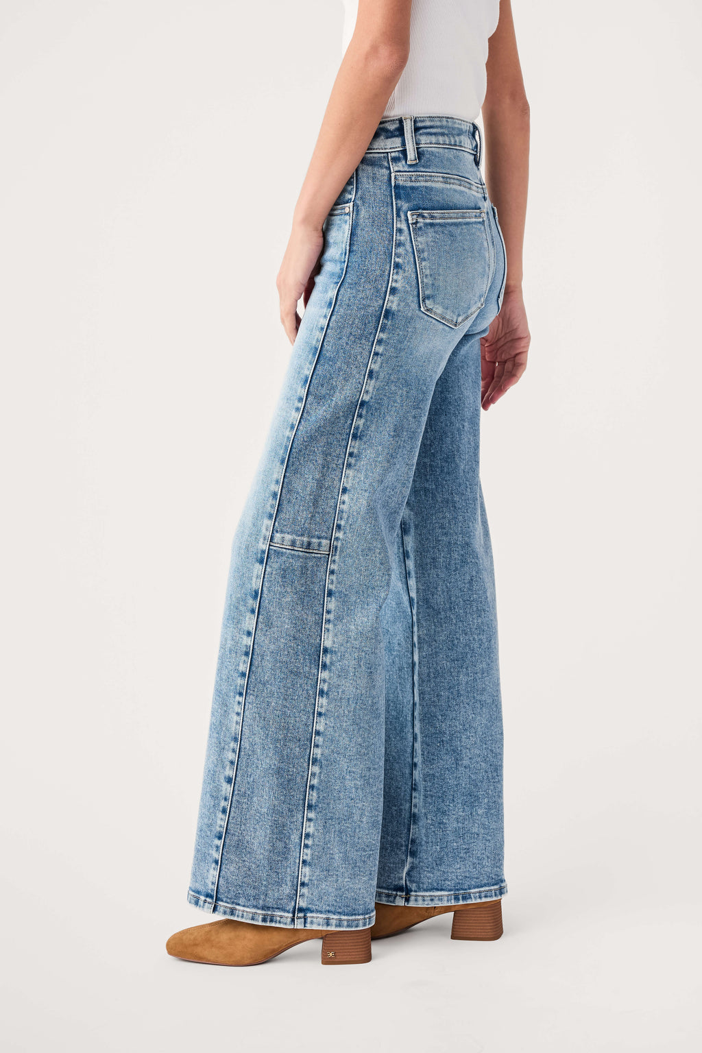 High-rise medium-wash wide-leg jeans showing side seams and back pockets