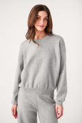 Relaxed crewneck sweater in heather gray with wide crew neck and ribbed waist hem