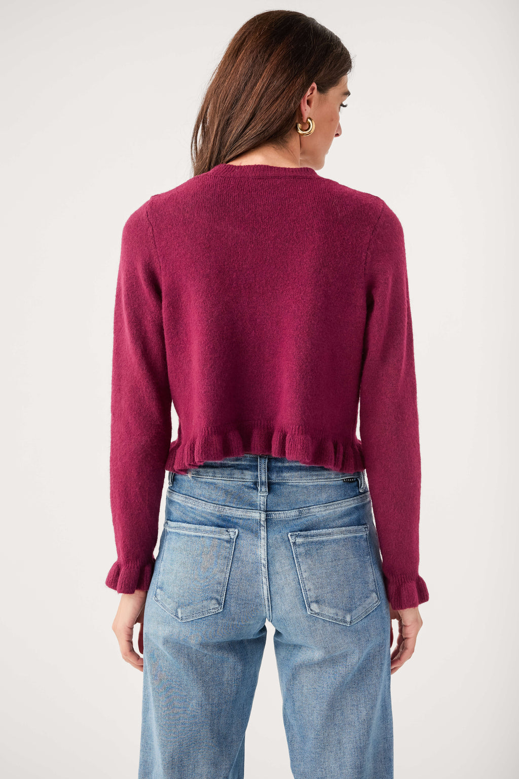 Wine ruffle-hem cardigan sweater, back view with button cuffs