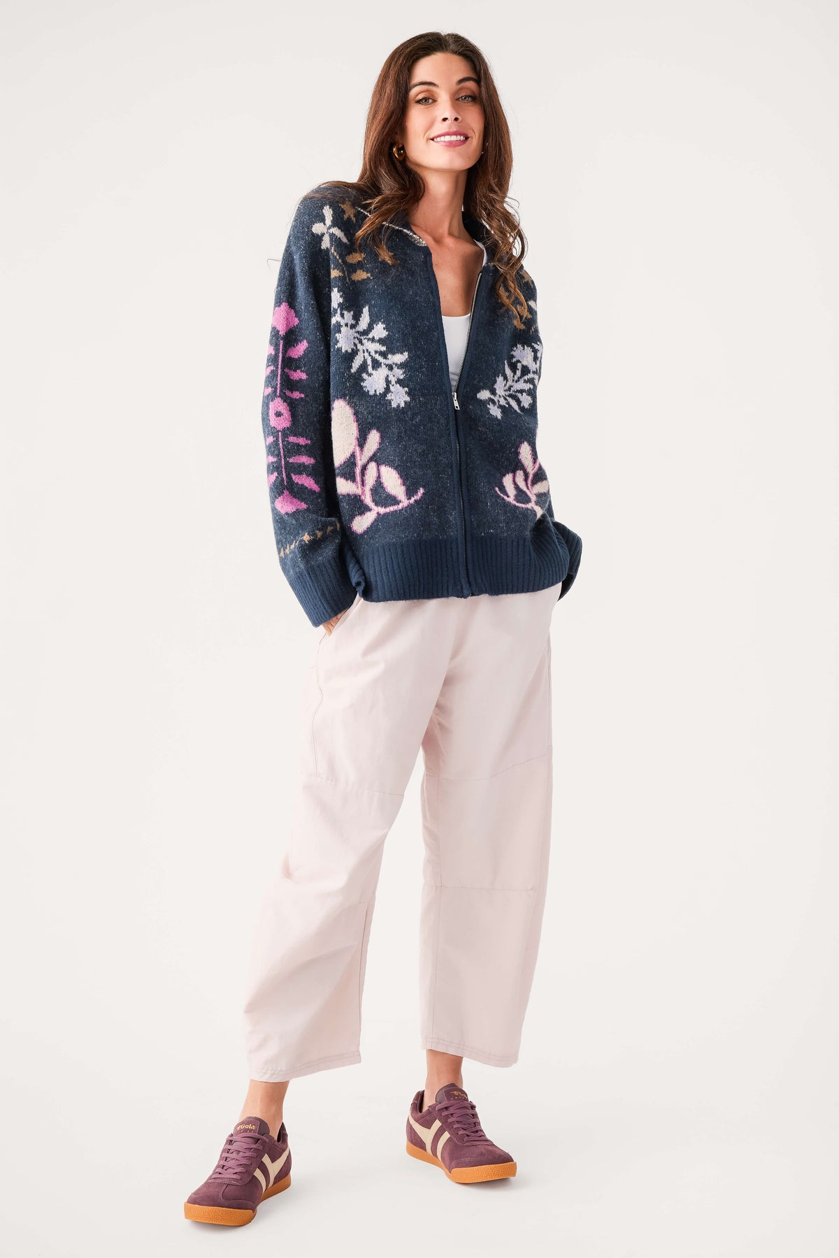 Navy zip-up cardigan with pink/white floral knit, ribbed cuffs and hem