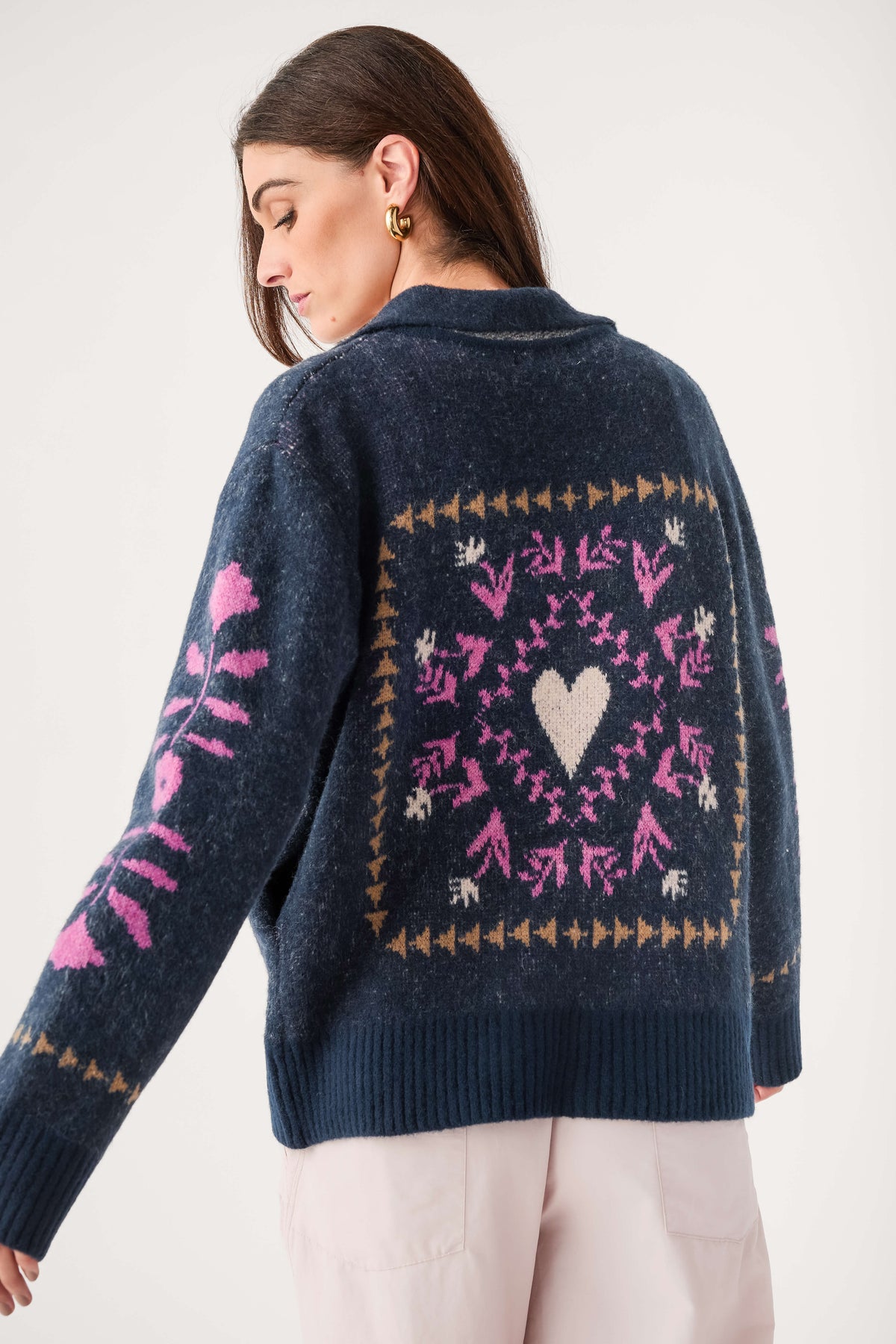 Navy back zip-up cardigan with pink heart and diamond knit pattern, ribbed hem