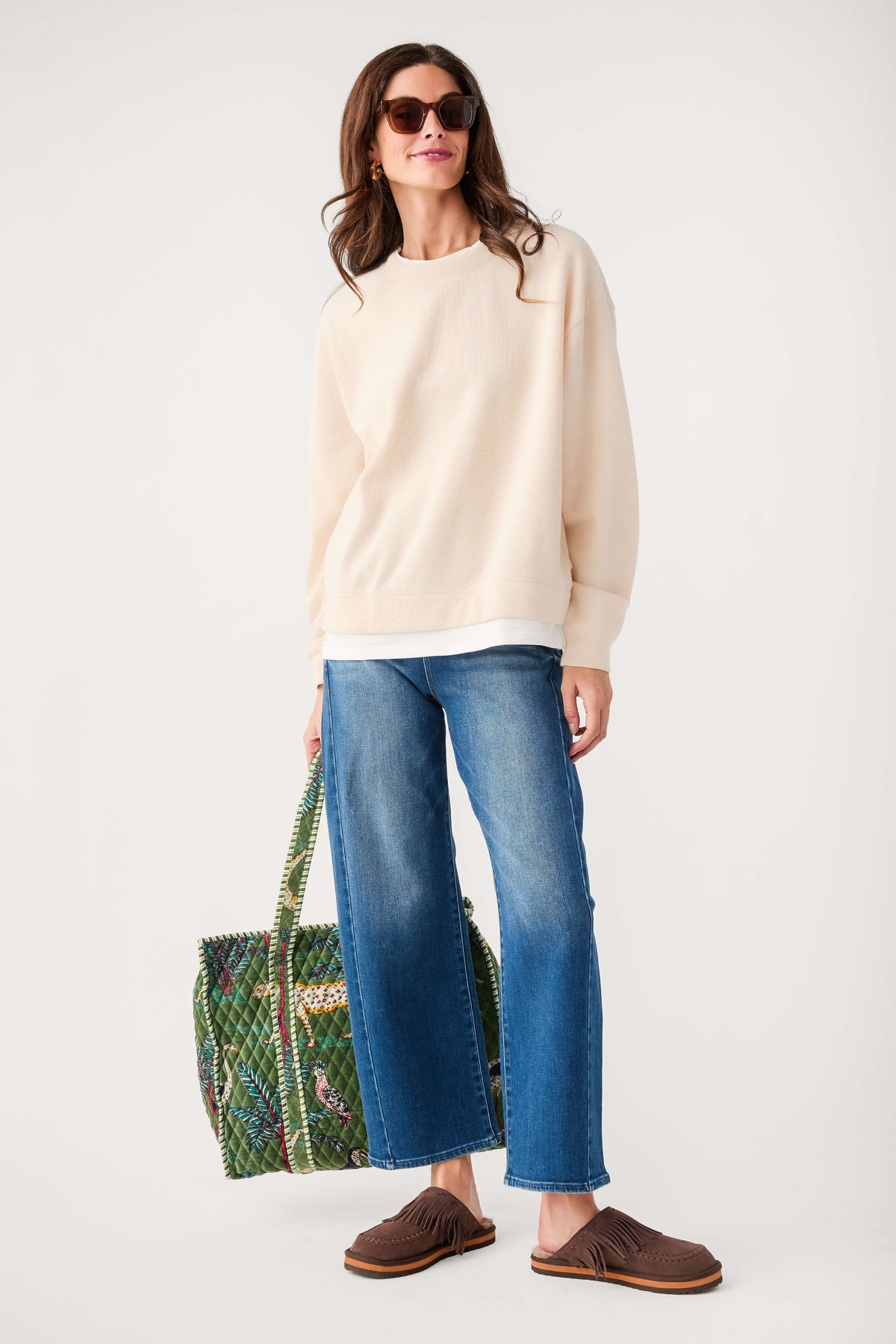 Cream crewneck pullover sweater with long sleeves, ribbed collar and cuffs
