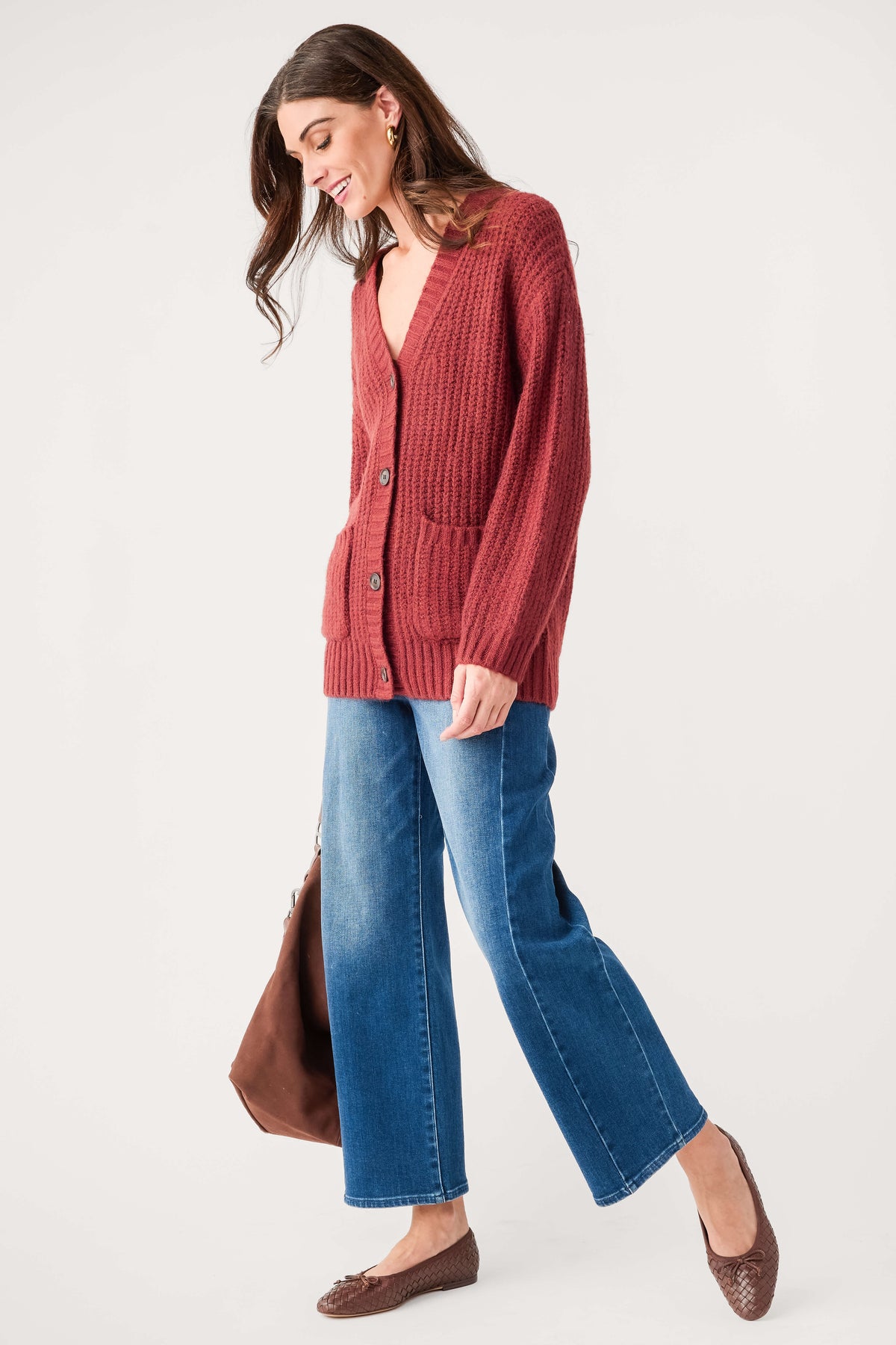 Red knit cardigan with button front, V-neck, and patch pockets