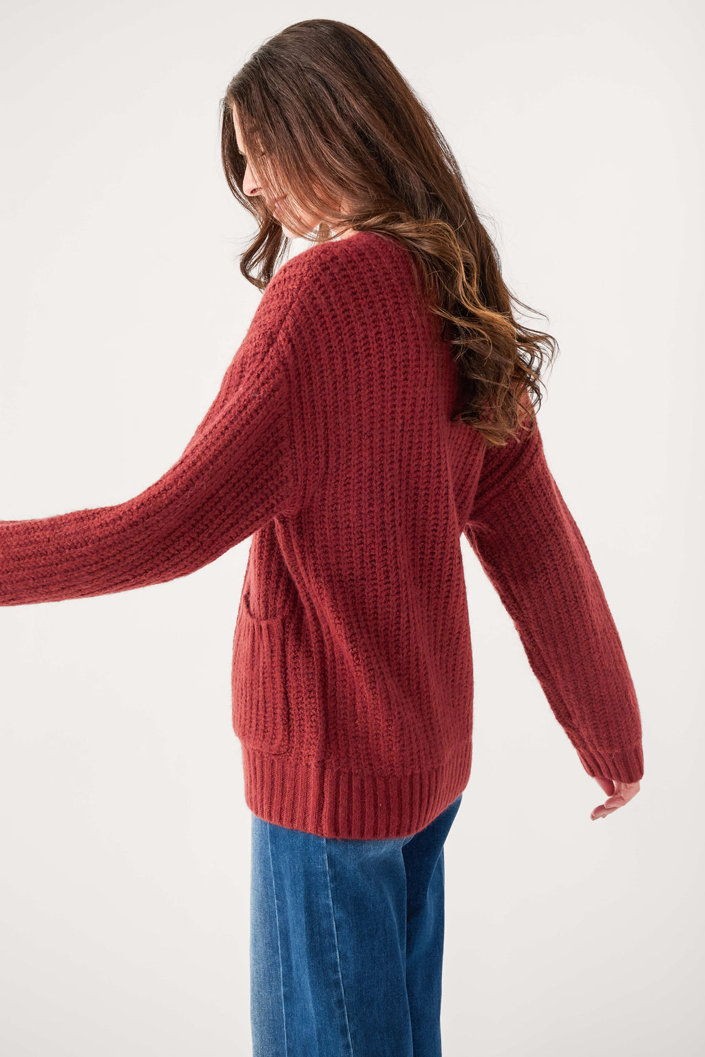 Red knit cardigan back view with ribbed hem and long sleeves