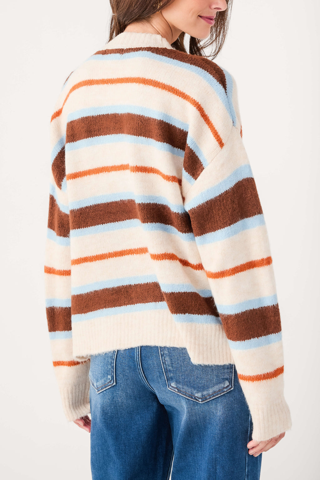 Striped cardigan back with long sleeves in cream, brown, blue, and orange horizontal stripes