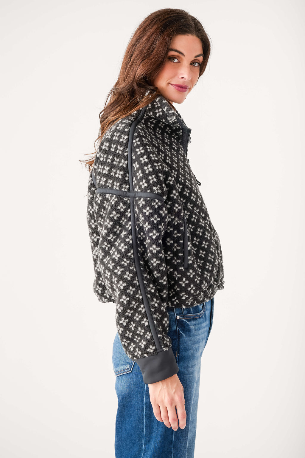 Black printed half-zip pullover hoodie, side view with zipper and ribbed cuffs