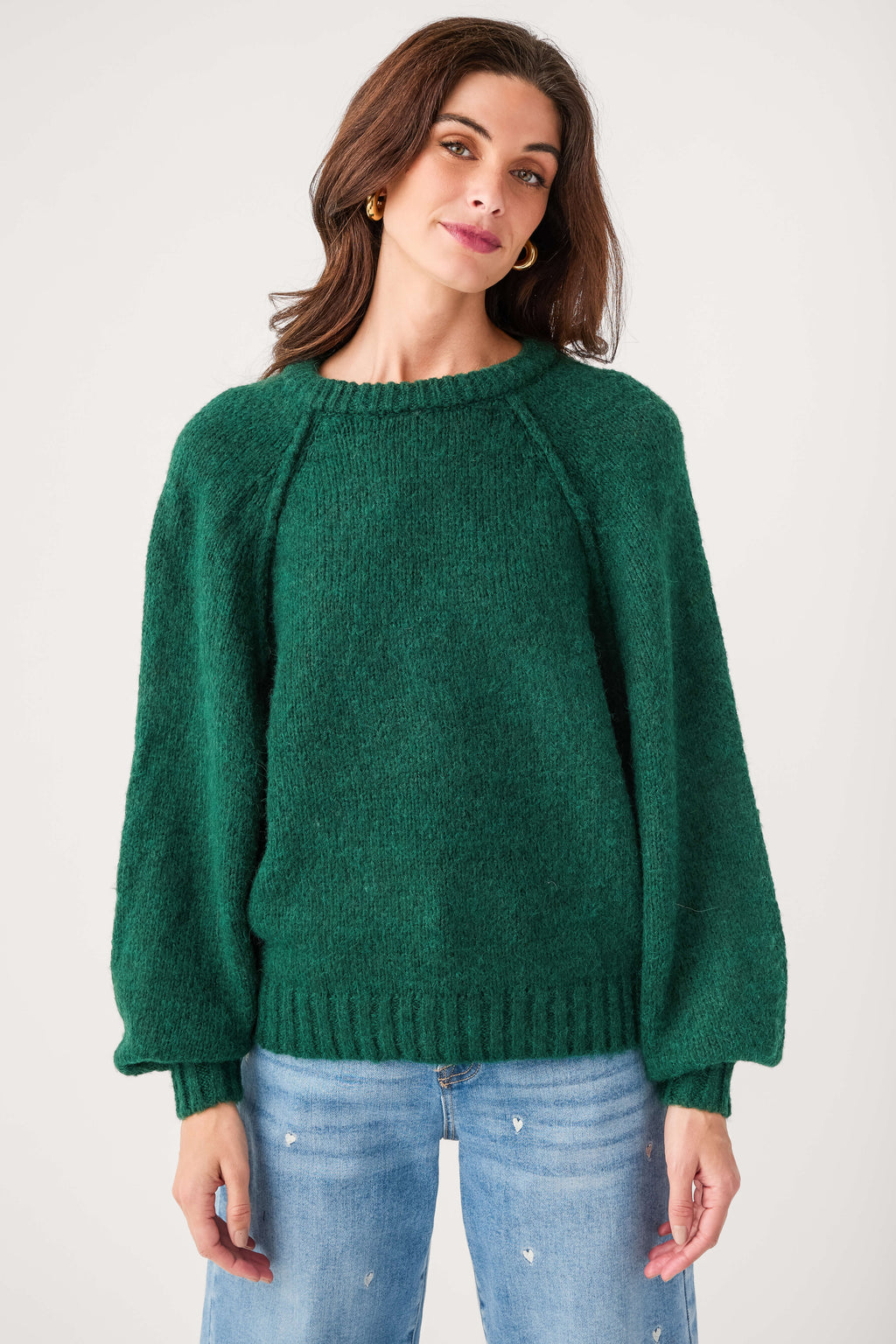 Forest green raglan sleeve pullover sweater with crew neck and ribbed hem
