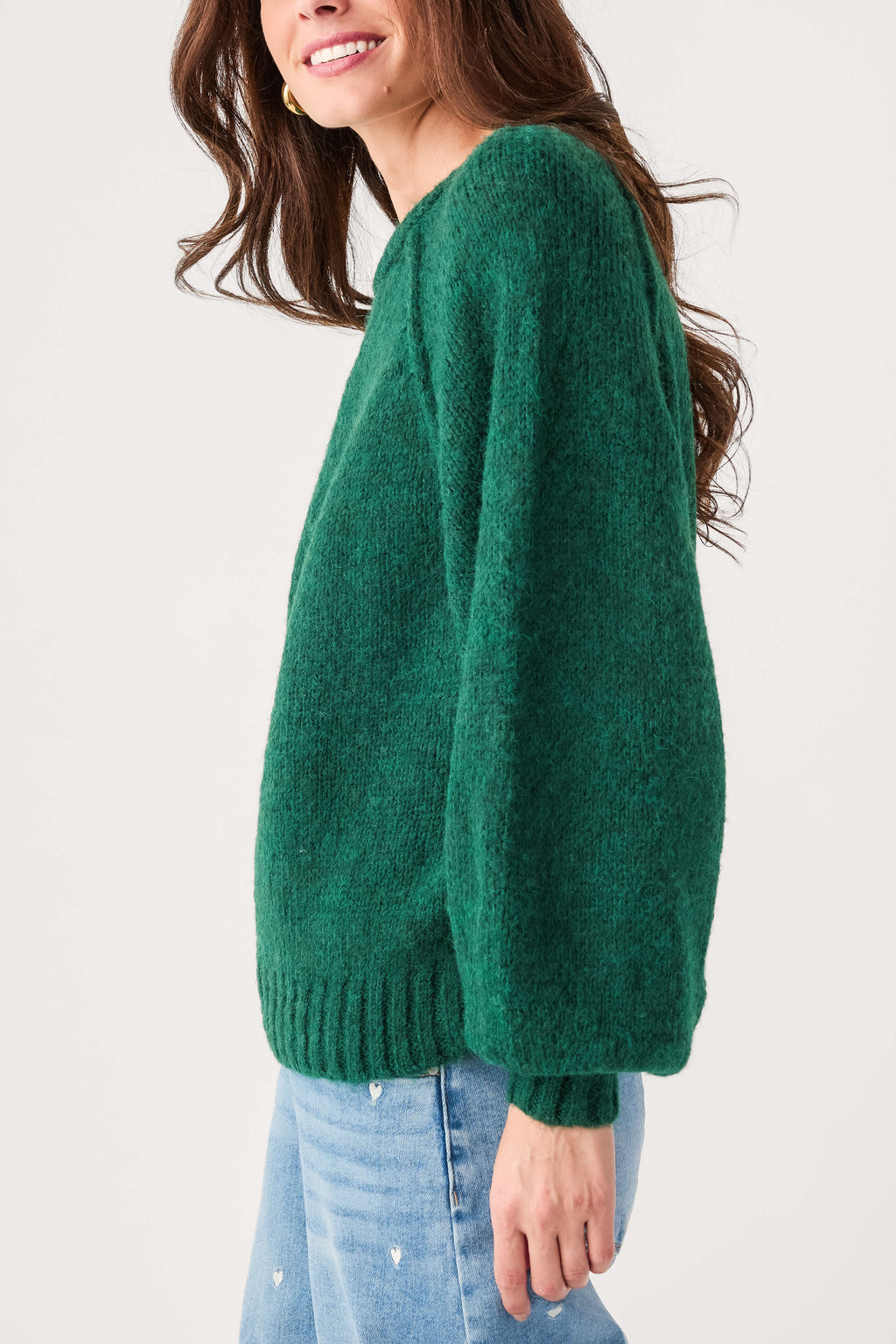 Forest green raglan sleeve sweater with wide sleeves and ribbed knit hem