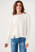 White textured crewneck sweater with frayed fringe hem and long sleeves