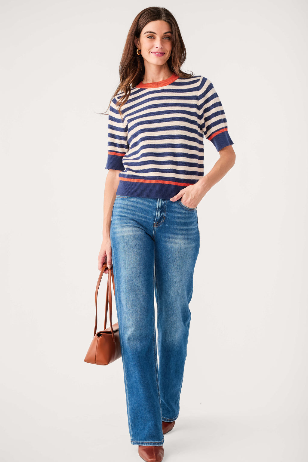 Navy striped knit top with crew neck, short sleeves, and orange-red hem trim