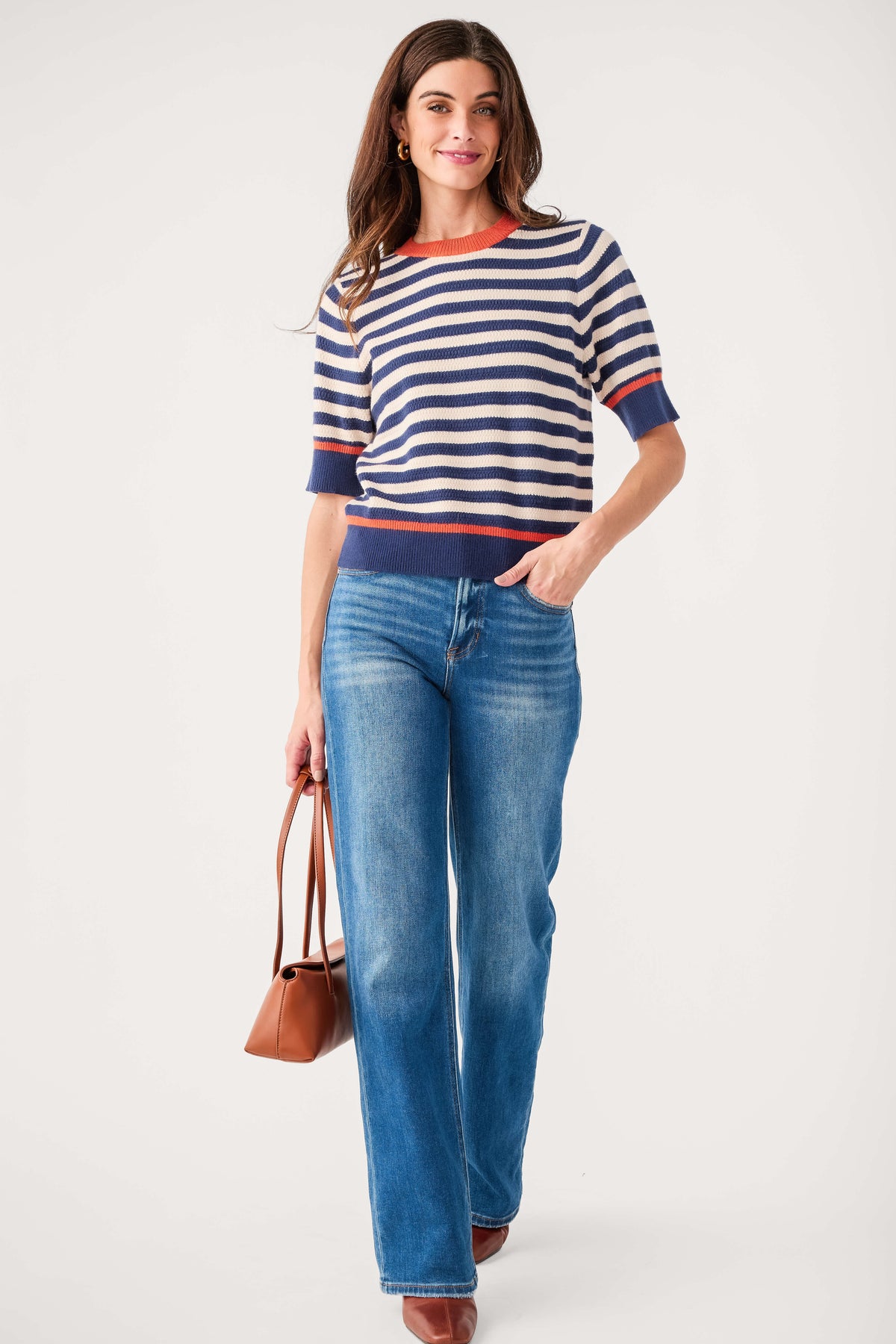 Navy striped knit top with crew neck, short sleeves, and orange-red hem trim