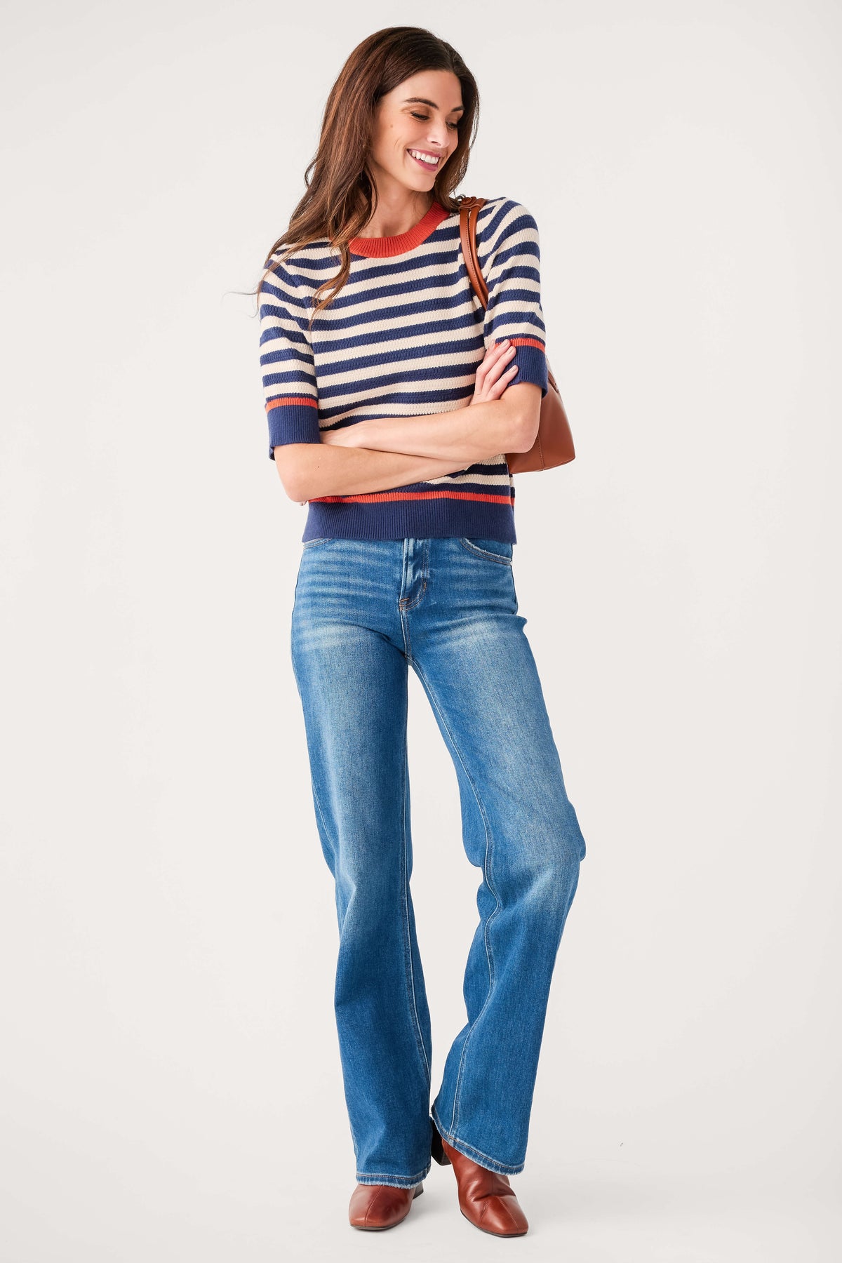 Navy and cream striped knit top with crew neck, short sleeves, orange-red cuffs