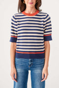 Striped knit top with crew neckline, navy and cream stripes, orange-red ribbed hem