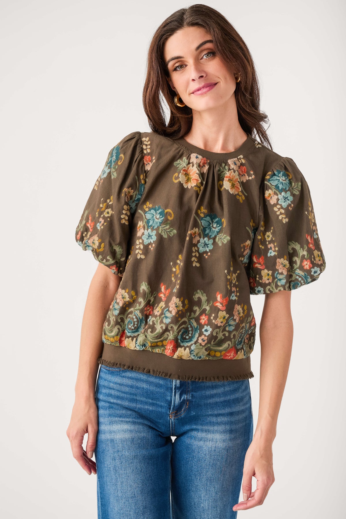 Dark brown floral embroidered top with short puff sleeves and curved hem