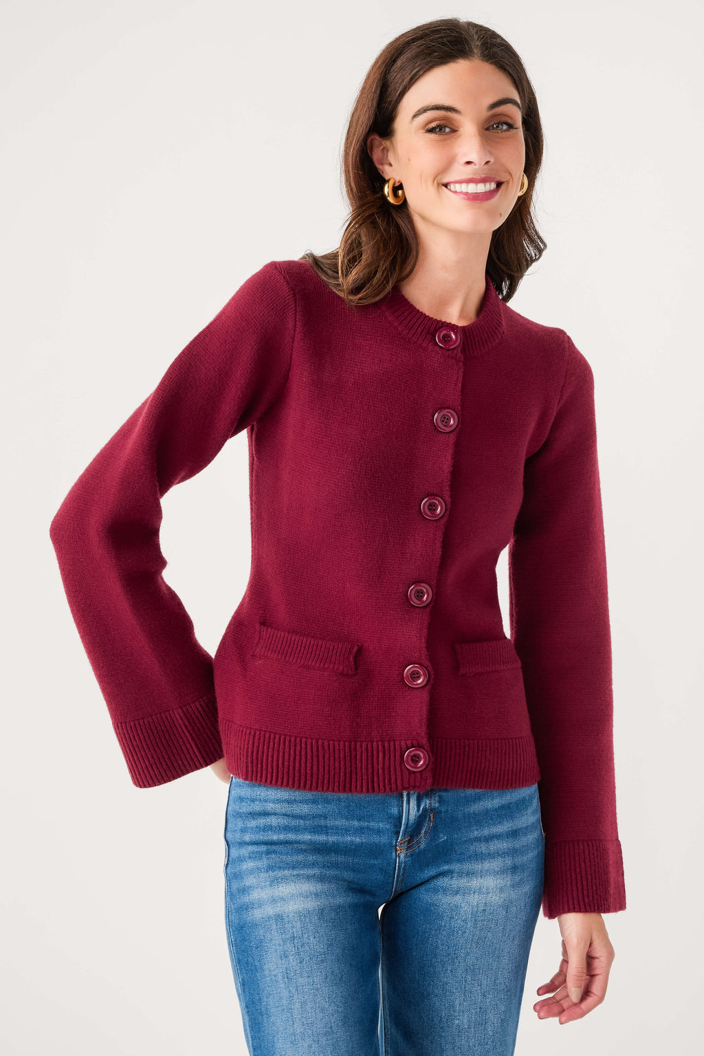 Burgundy fitted cardigan with button front, ribbed cuffs, and front pocket