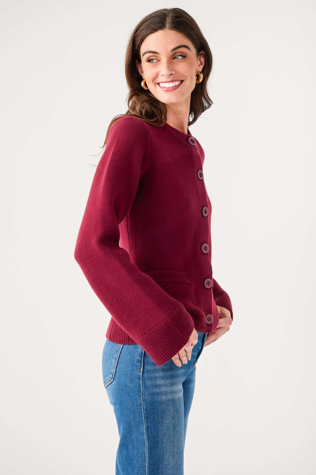 Burgundy fitted cardigan with button front and bell sleeves, side view