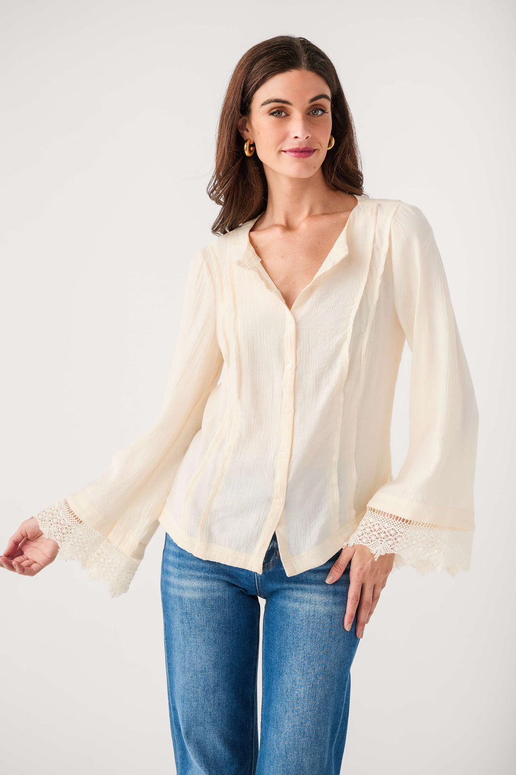 Ivory button-front blouse with V-neck and sheer long sleeves, lace cuff trim