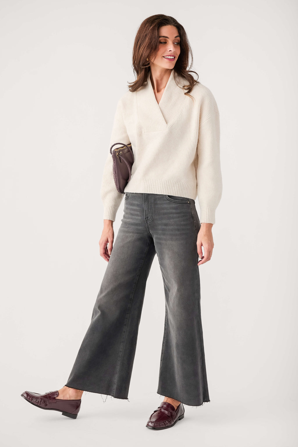 Cream shawl-collar V-neck knit sweater with long sleeves and ribbed hem