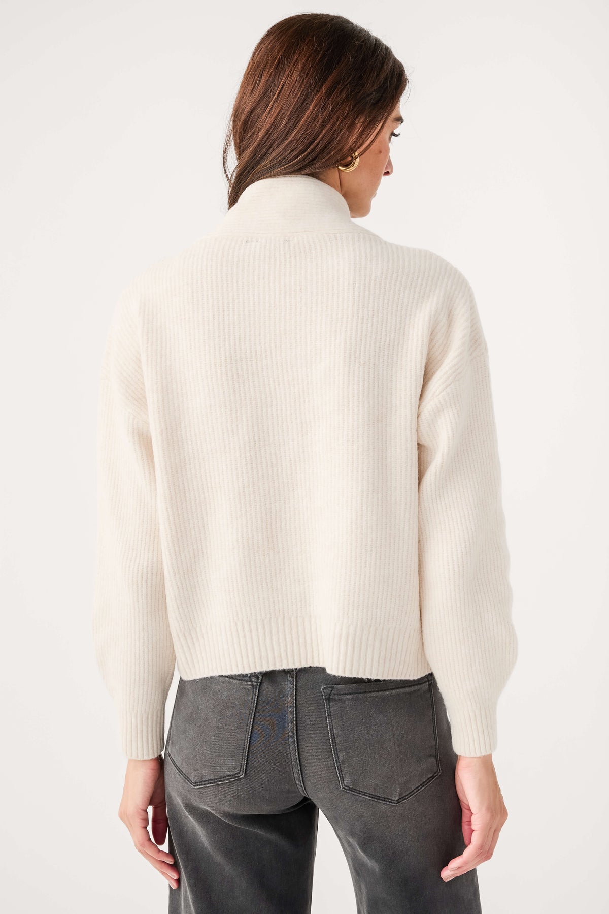 Cream knit shawl-collar sweater with ribbed cuffs and hem, back view