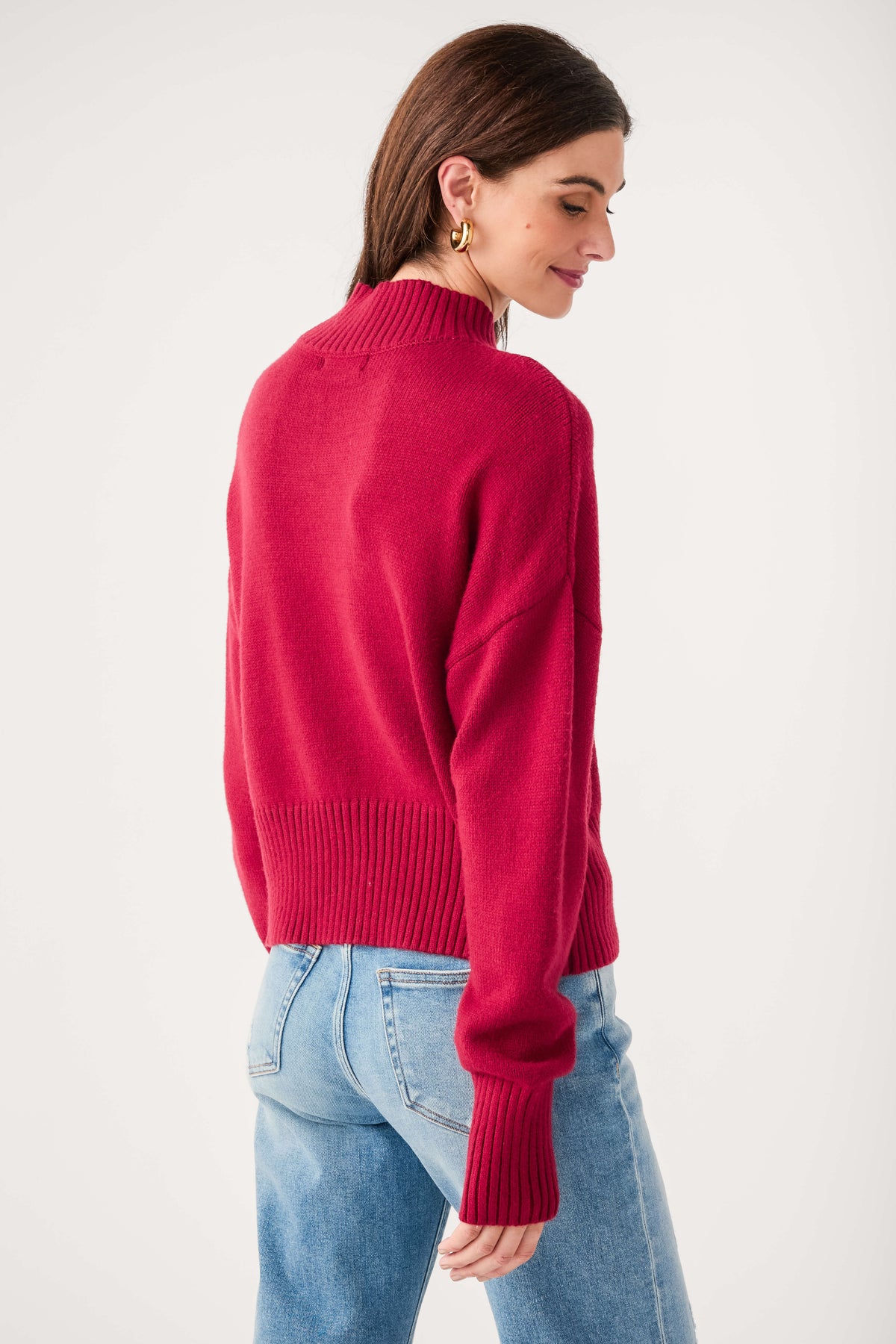 Wine mock neck knit sweater, back view with ribbed cuffs and hem detail