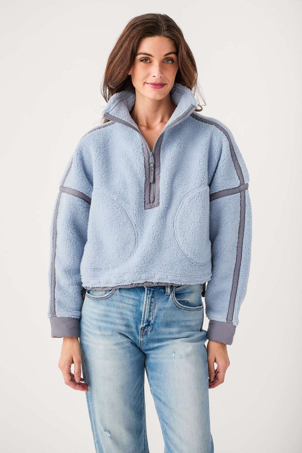 Light blue fleece 1/2-zip pullover with stand collar and gray contrast stripes