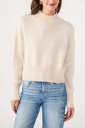 Ivory mock neck sweater with ribbed neckline and cuffs, knit texture detail