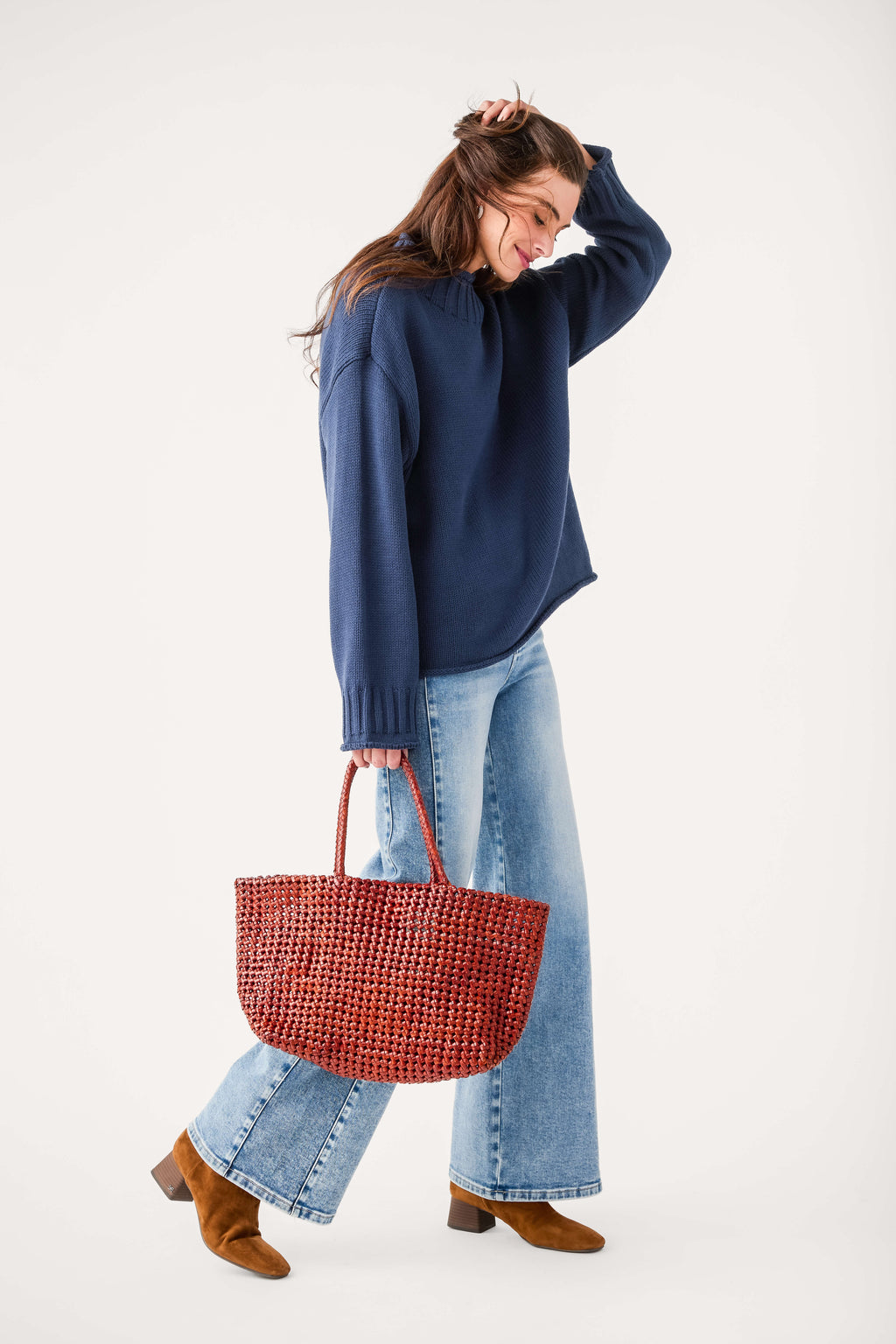 Light-wash high-rise wide-leg jeans with contrast seams and flared cuffs