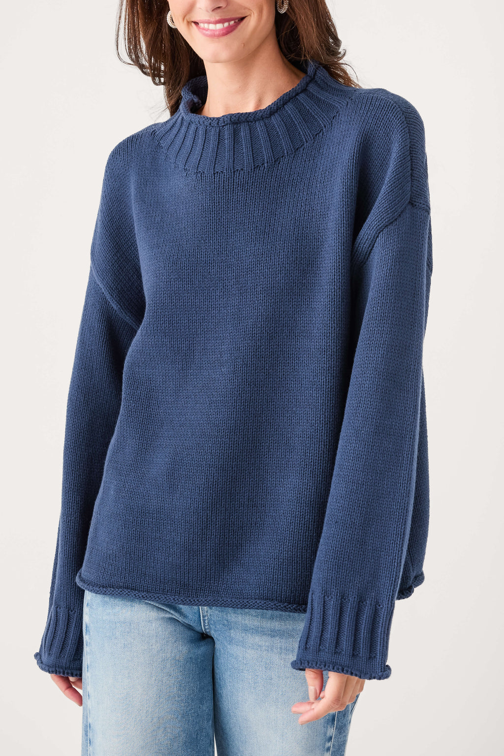 Navy mock neck knit sweater with ribbed neckline and long sleeves