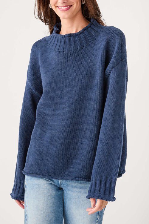 Navy mock neck knit sweater with ribbed neckline and long sleeves