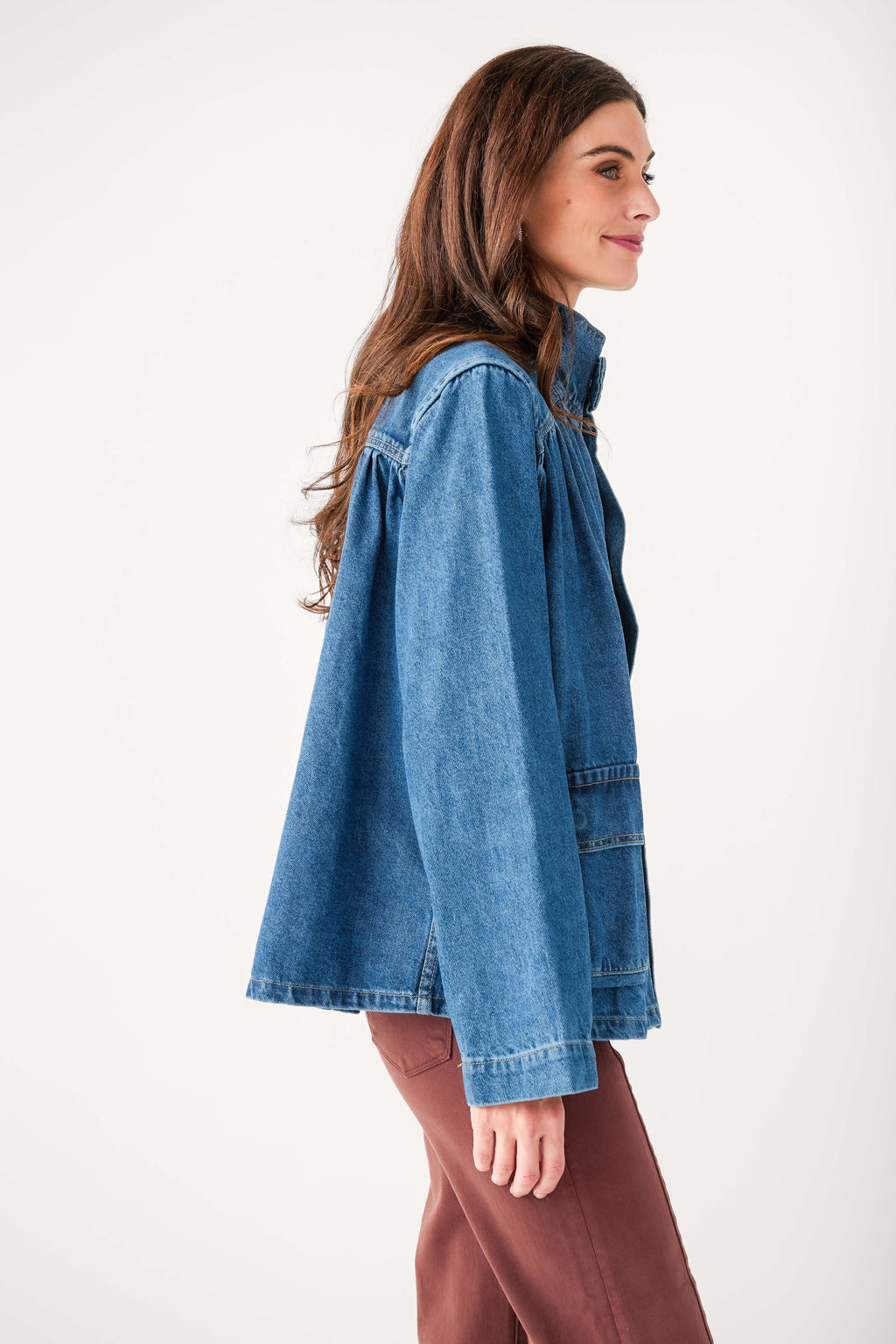 Dark blue oversized denim jacket with shoulder yoke pleats and long sleeves