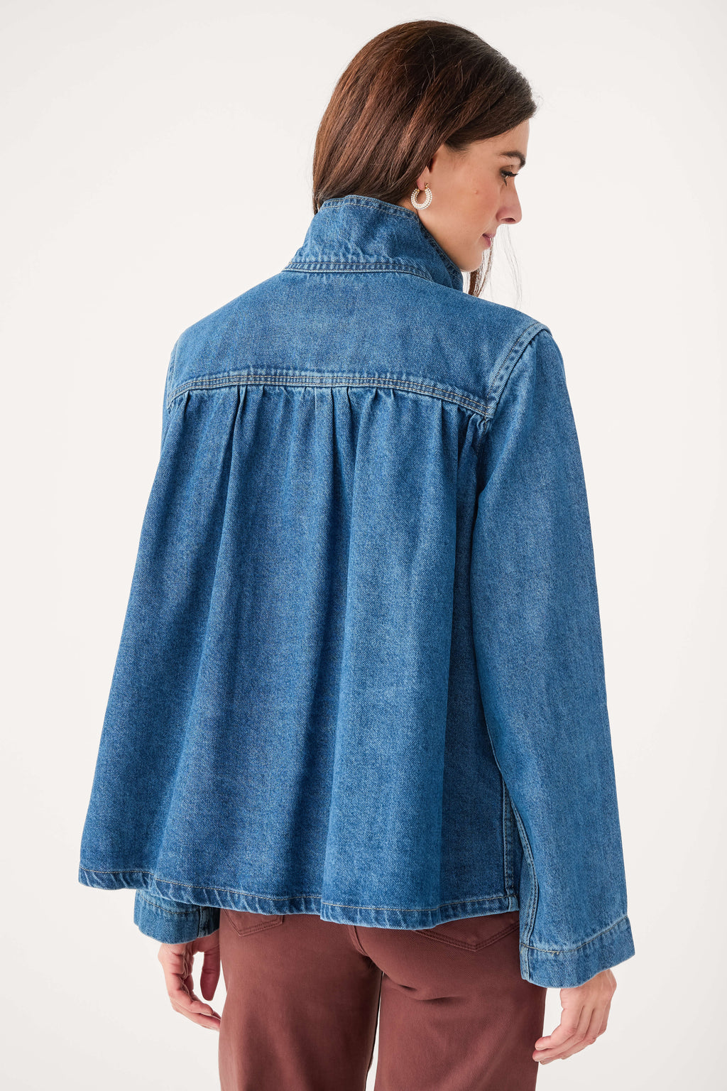 Dark blue denim jacket with back yoke shaping and buttoned cuff details