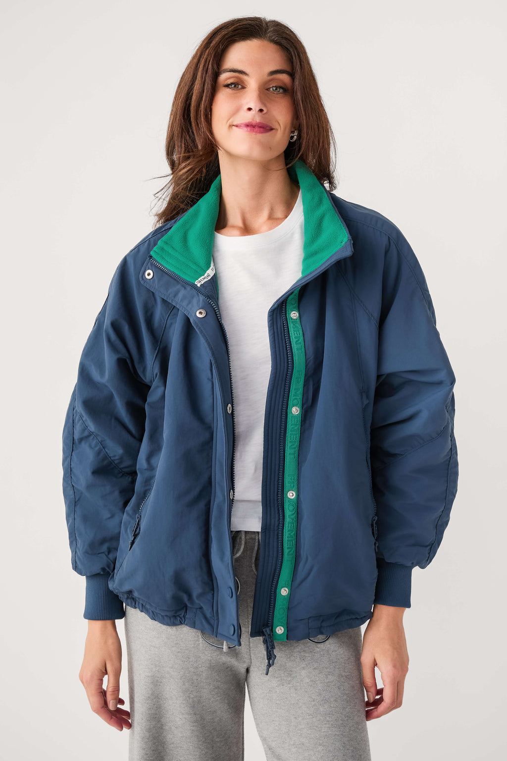 Midnight navy field jacket with green stand collar and snap front