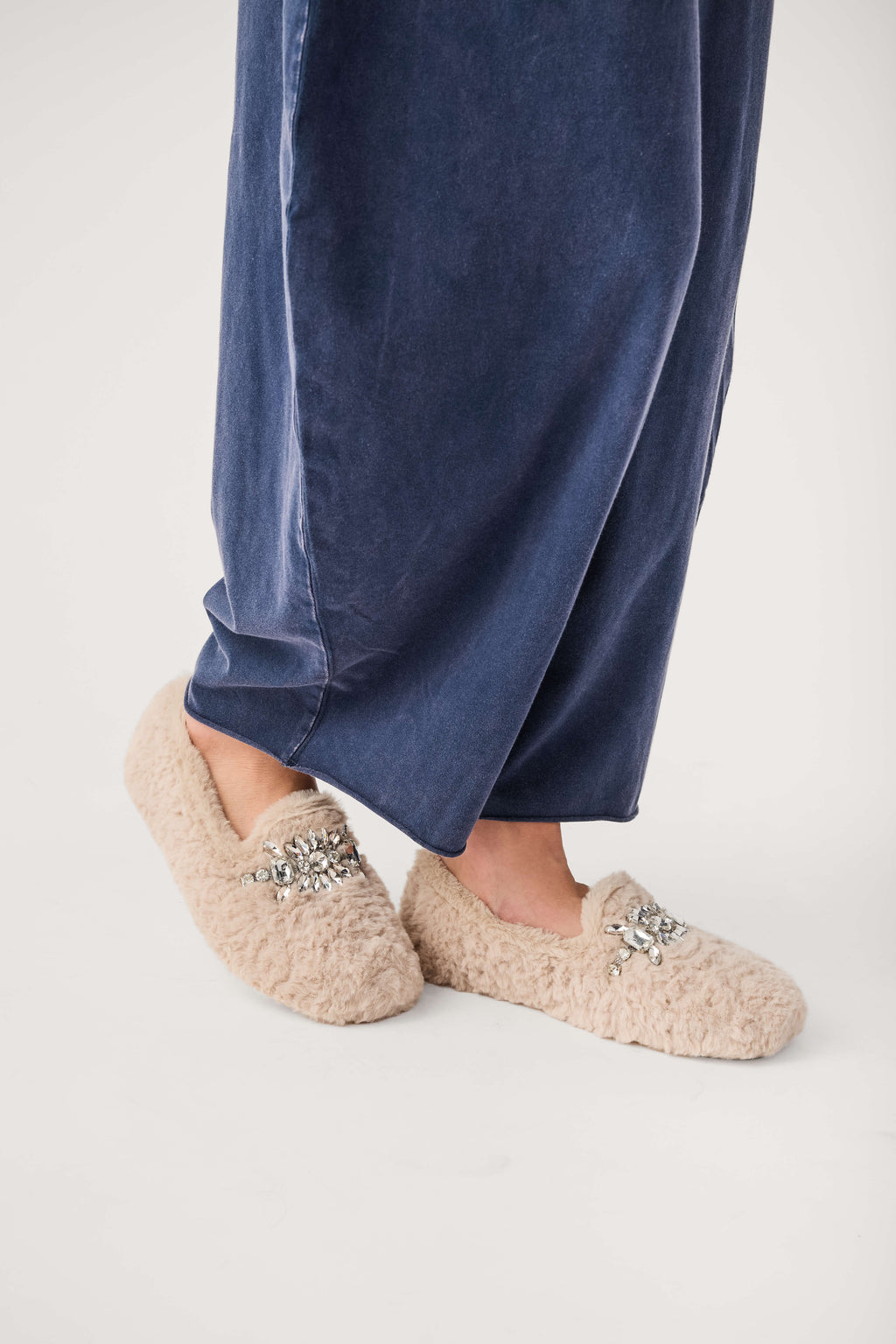 Beige fuzzy loafer slippers with silver jeweled floral detail, low profile