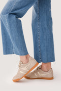 Bone lace-up mirror sneakers with gum sole, front three-quarter view