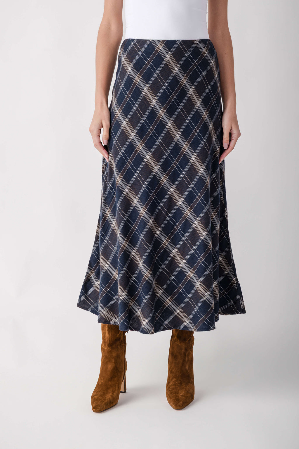 Navy plaid A-line skirt with cream and tan diamond pattern, midi length.