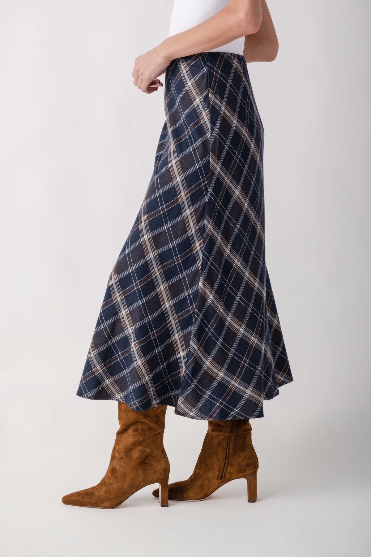 Navy plaid A-line skirt with cream and rust grid pattern, midi length.