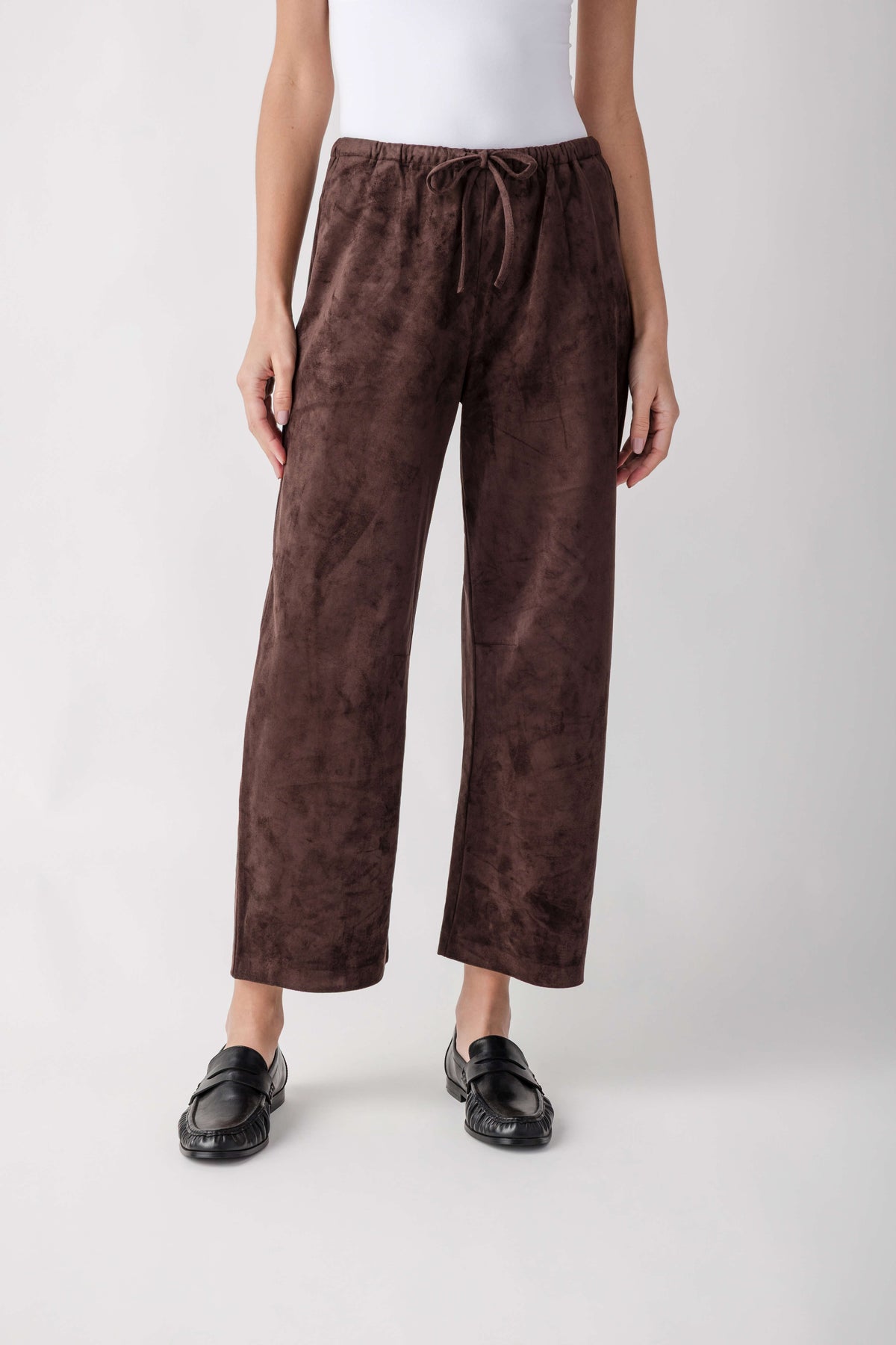 Brown suede pull-on pants with drawstring waist and straight wide-leg silhouette, cropped ankle length.