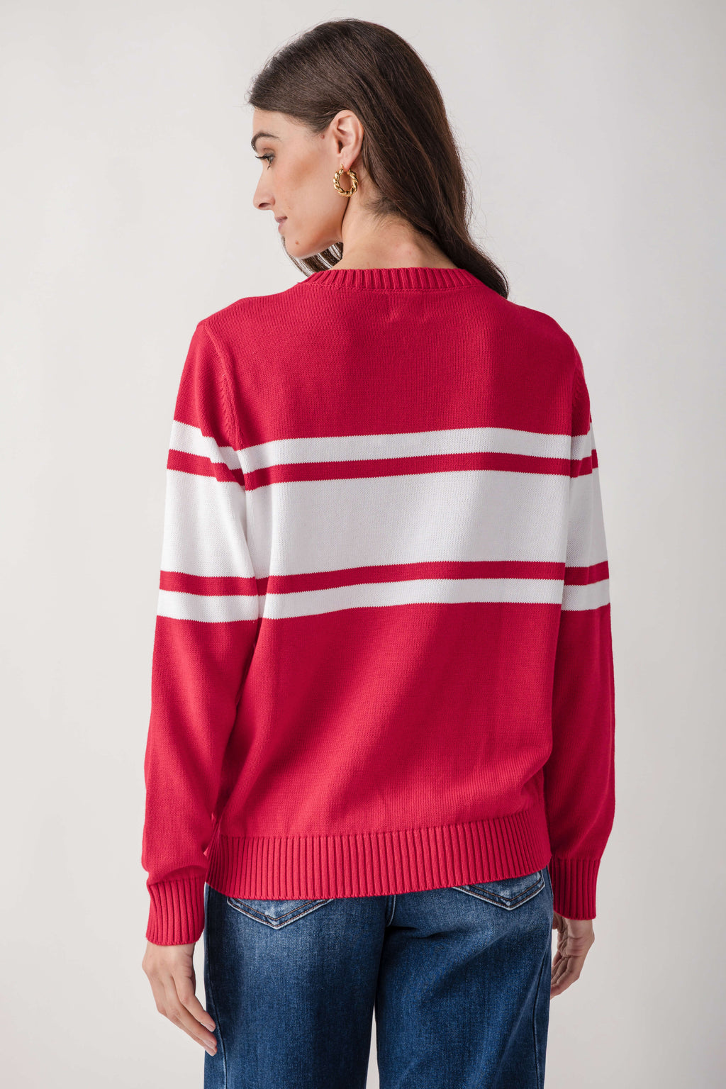 Red and white striped knit sweater with crew neck and ribbed cuffs, shown from back view on model.