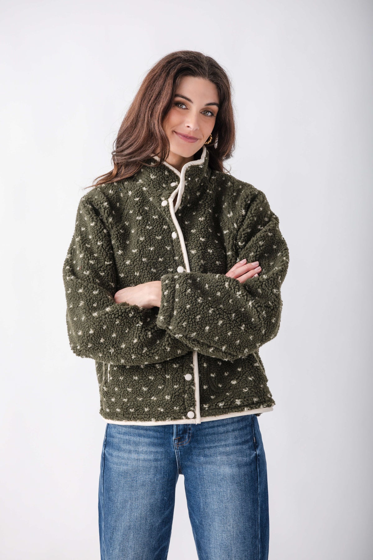 Olive green sherpa fleece jacket with white dot pattern, white snap closures, and contrasting white trim on collar and front.