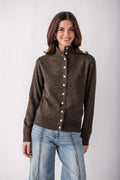 Brown ribbed cardigan with mock neck and white buttons, worn with light blue jeans.