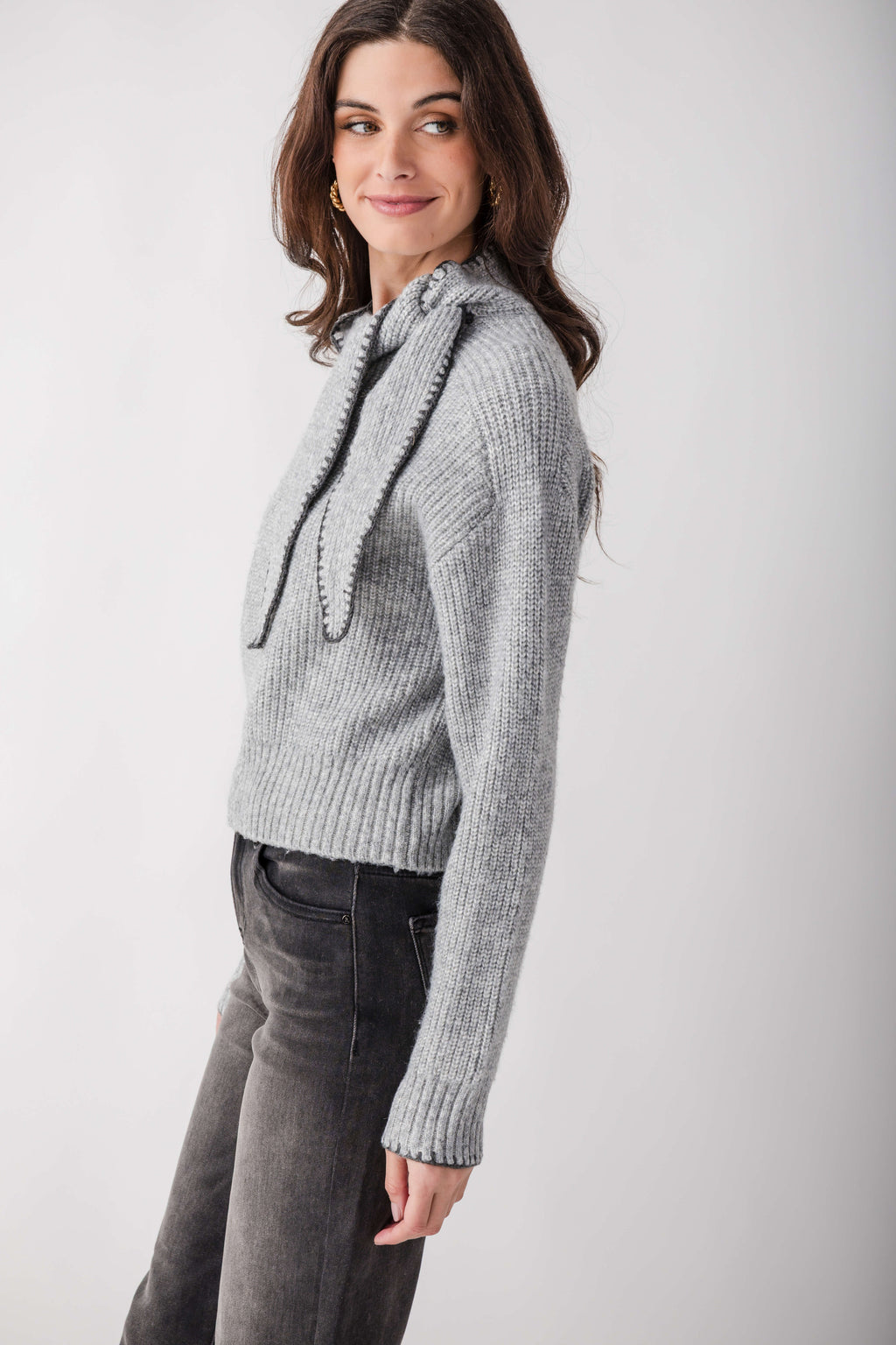 Gray ribbed knit sweater with attached scarf collar featuring contrast stitching detail.