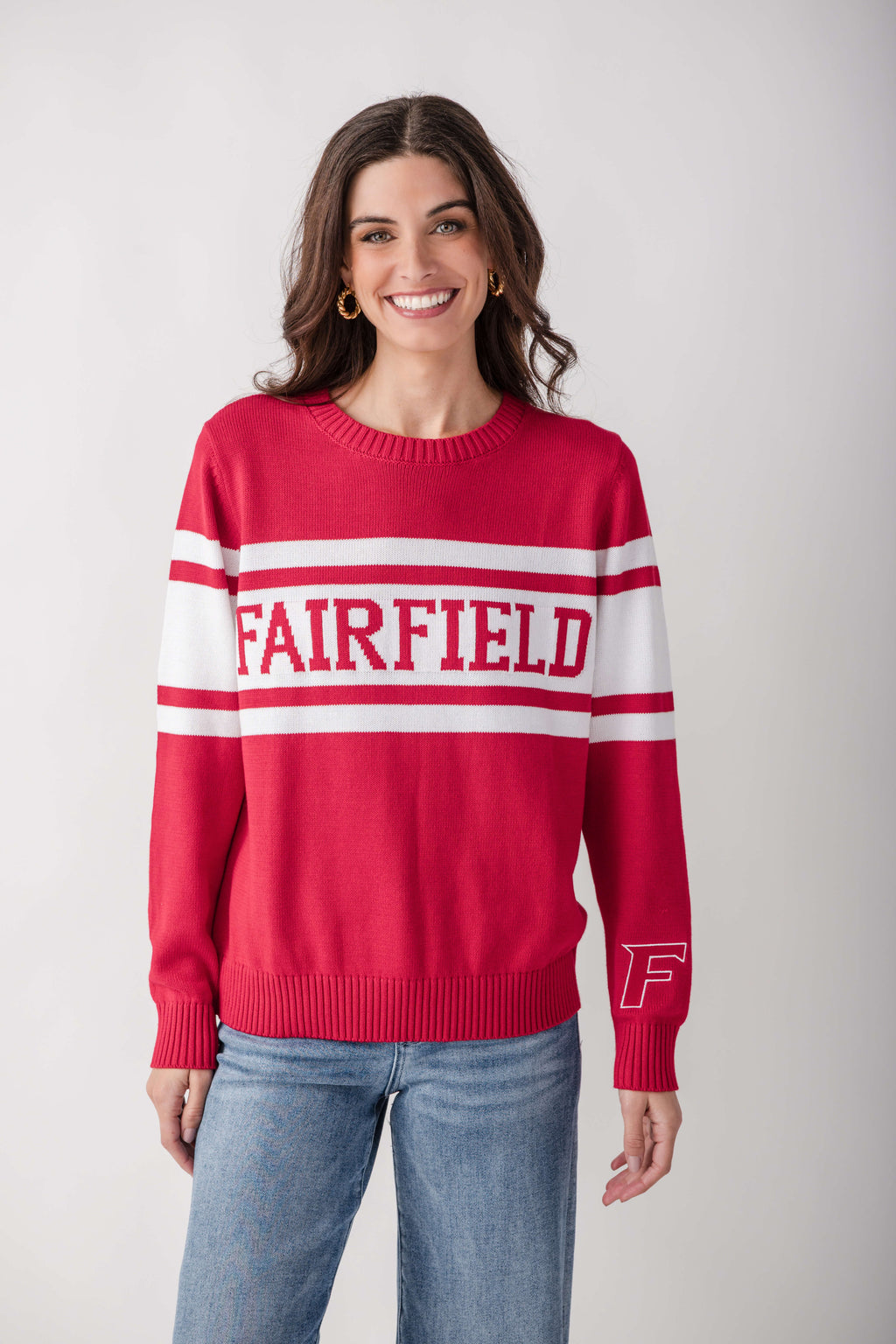 Red and white striped knit sweater with "FAIRFIELD" text across chest and "F" logo on sleeve.