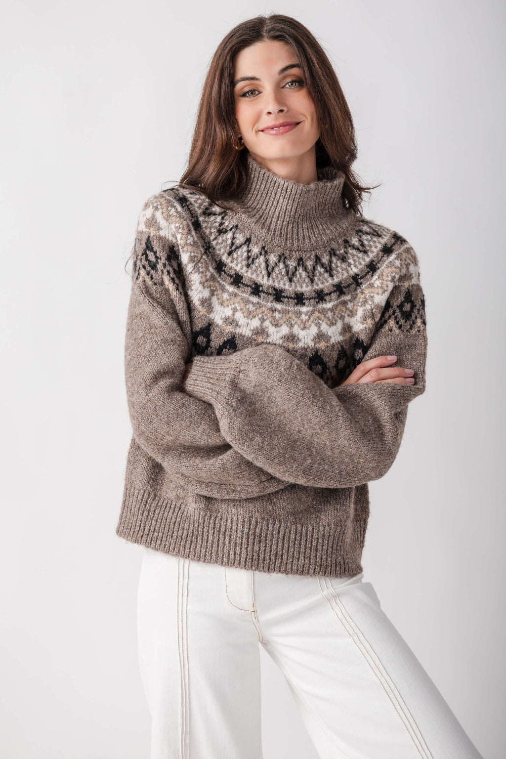 Gray turtleneck sweater with black and cream geometric pattern across chest and shoulders.