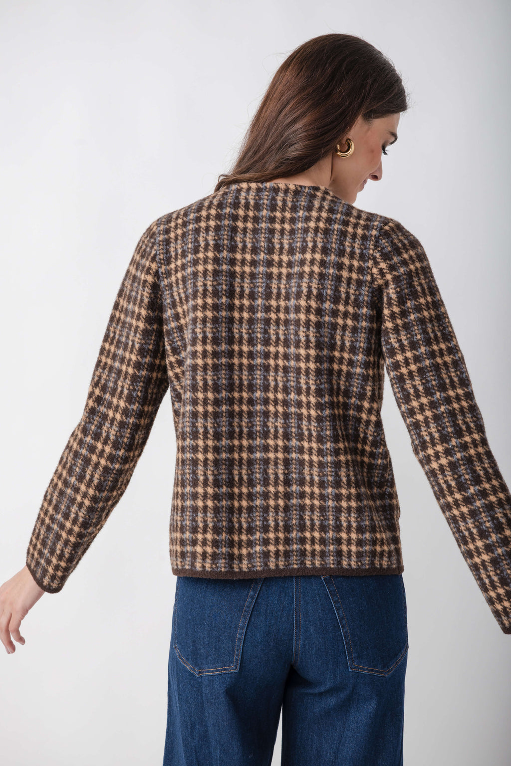 Brown and tan houndstooth tweed jacket with long sleeves, shown from back view on model wearing blue jeans.