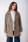 Brown and tan houndstooth pea jacket with notch lapels, button front, and patch pockets, worn over cream ribbed sweater.