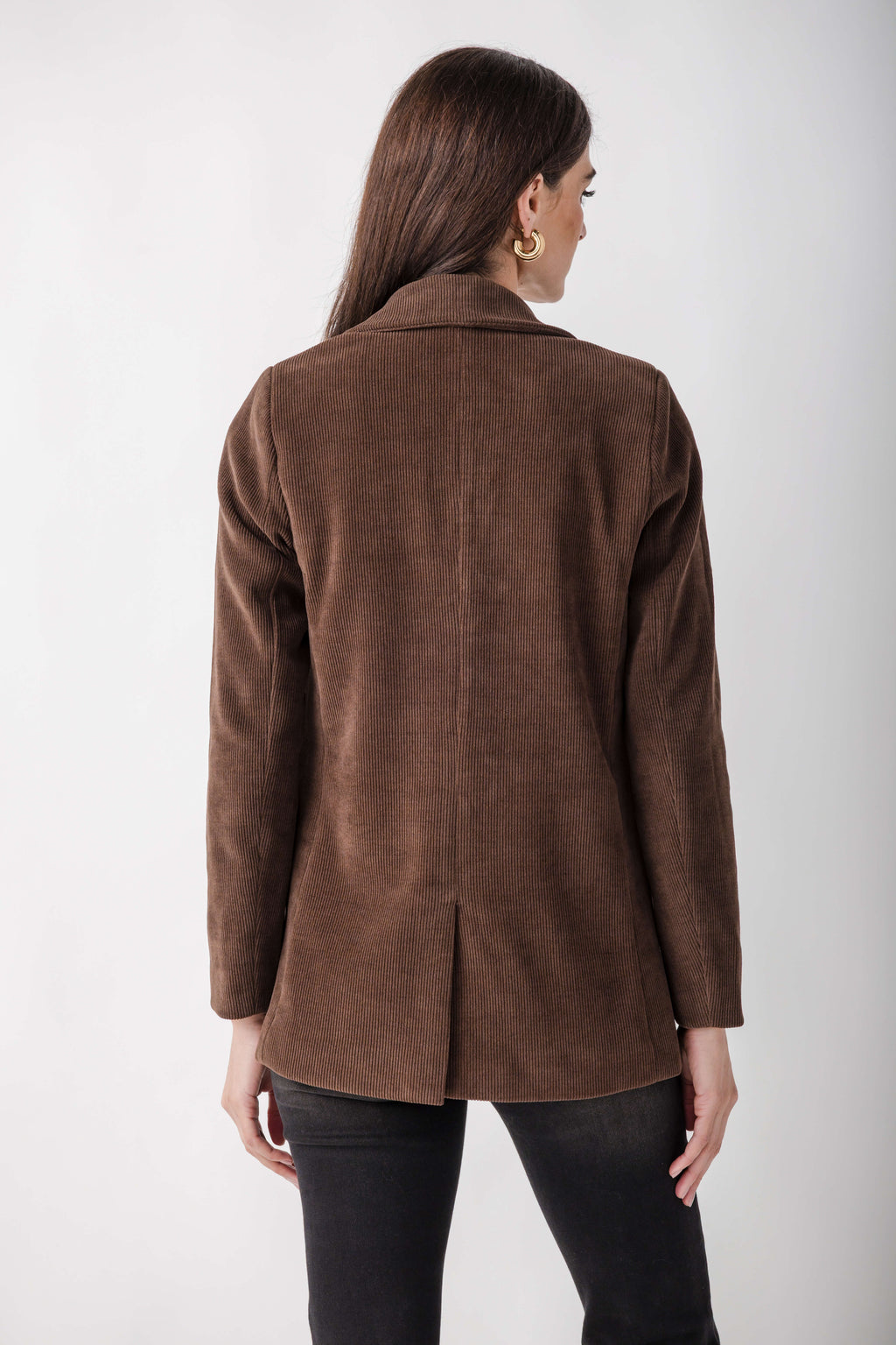 Brown corduroy blazer with notch lapels and long sleeves, shown on model from back view.
